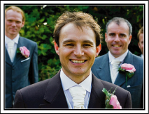 Composing the picture with the guests in front and the bride and groom at the back